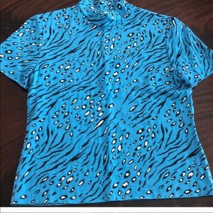 St. John, mock turtleneck. Rayon, viscose knit.